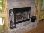Out Door Fireplace in the Upper Screened in Deck